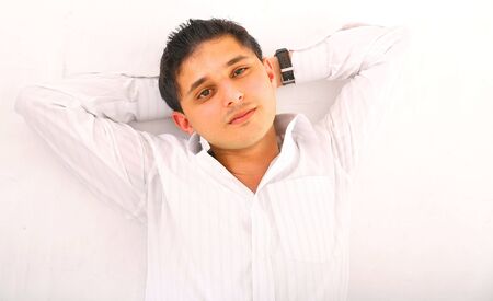 young man laying down relax on the floorの写真素材