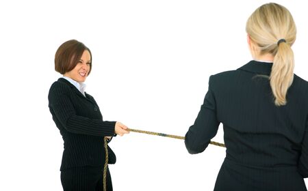 female businesswoman showing struggle face pulling rope with another businesswoman. concept for...
