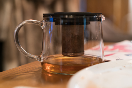 the teapot is on the table.の写真素材