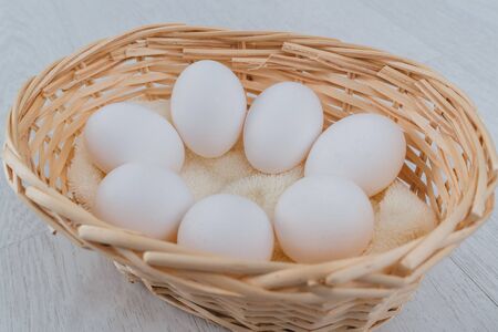 White eggs in a basket.の写真素材