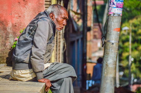 Nepal - 26 April 2015: Old man of Nepal Durbar Square in Kathmandu, Nepalのeditorial素材