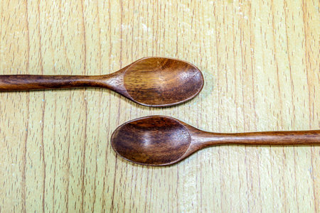 wooden spoon isolated on tableの写真素材