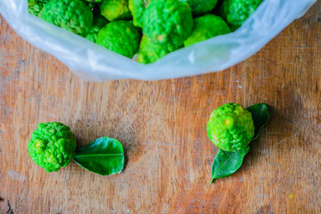 kaffir lime in plastic bag on table, selective focus point.
