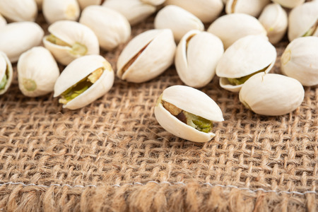 Pistachios isolated on white backgroundの写真素材