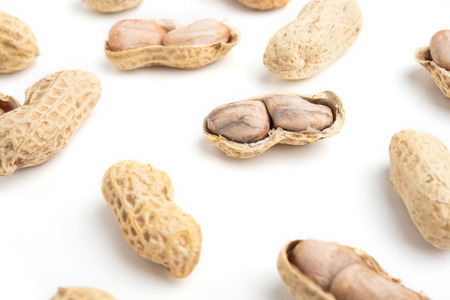 Peanuts isolated on white background. Peanut macro.