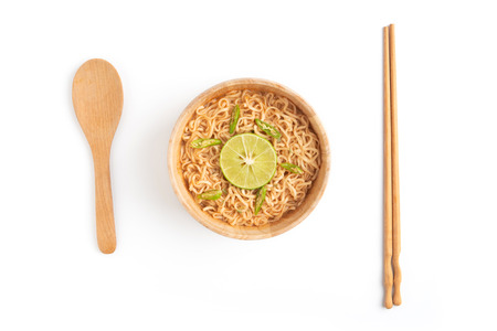 Wooden bowl of noodles isolated on white background.
