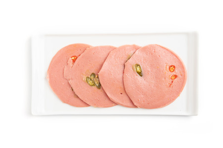 Boiled sausage slices isolated on white background.の写真素材