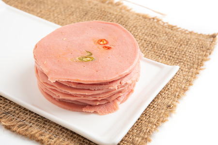 Boiled sausage slices isolated on white background.の写真素材