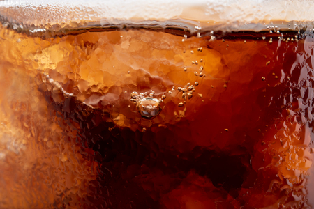 Cola in a glass isolated on white background.の写真素材