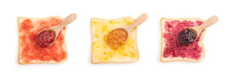 Toast sandwiches with strawberry, orange and blueberries jam isolated on white background, top viewの写真素材