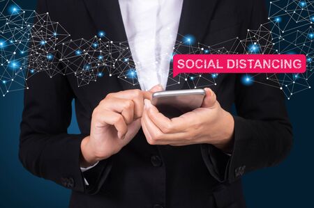 Social distancing concept, Businesswoman using mobile smart phoneの写真素材