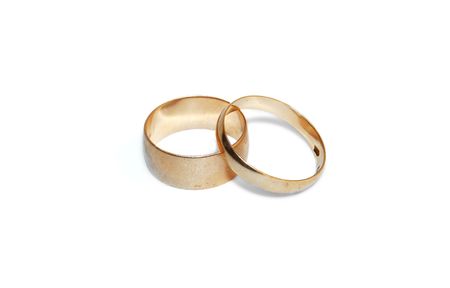 Two wedding rings are isolated on a white background.の写真素材