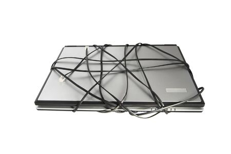 The laptop with network cable, are isolated on a white backgroundの写真素材