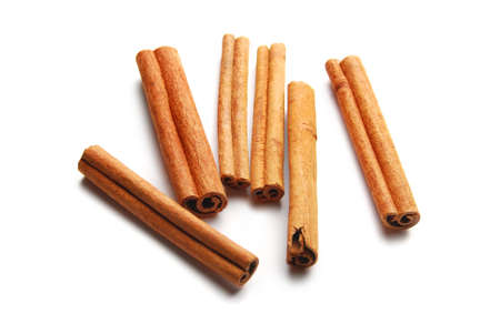 The cinnamon sticks, are isolated on a white backgroundの写真素材