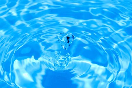 Transparent water drop in the form of heartの写真素材