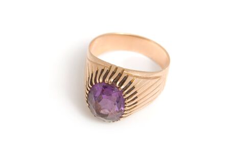 The Golden Ring with amethyst, is isolated on a white backgroundの写真素材