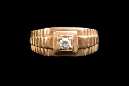 Man's ring with diamond, is isolated on a black backgroundの写真素材