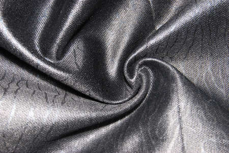Glossy silk fabric texture of the black colorの写真素材
