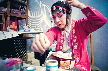 CHENGDU, CHINA-MARCH 12, 2011: Unidentified actor prepares backstage for the Sichuan opera on March 12, 2011, in Chengdu, China.  Sichuan opera is a Chinese folk tradition that originated in China around 1700.のeditorial素材