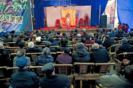 CHENGDU, CHINA-MARCH 12, 2011: Unknown audience in a show for the Sichuan opera on March 12, 2011, in Chengdu, China.  Sichuan opera is a Chinese folk tradition that originated in China around 1700.のeditorial素材