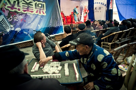 CHENGDU, CHINA-MARCH 12, 2011: Unknown audience in a show for the Sichuan opera on March 12, 2011, in Chengdu, China.  Sichuan opera is a Chinese folk tradition that originated in China around 1700.のeditorial素材
