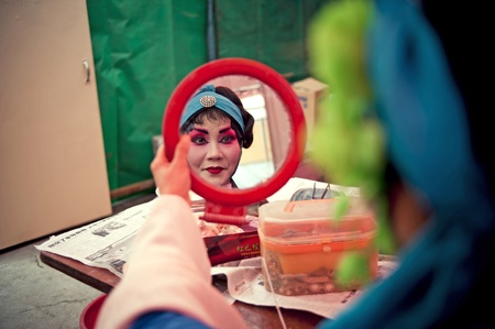 CHENGDU, CHINA-MARCH 12, 2011: Unidentified actor prepares backstage for the Sichuan opera on March 12, 2011, in Chengdu, China.  Sichuan opera is a Chinese folk tradition that originated in China around 1700.のeditorial素材