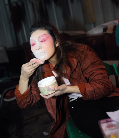 CHENGDU, CHINA-DECEMBER 11, 2011: Unidentified actor prepares backstage for the Sichuan opera on DECEMBER 11, 2011, in Chengdu, China.  Sichuan opera is a Chinese folk tradition that originated in China around 1700.のeditorial素材