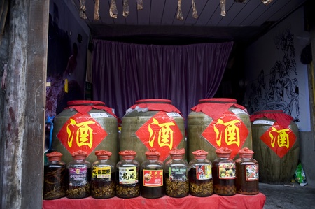 Sichuan, China - February 17: A shop selling homemade liquor, containers filled with a variety of liquor sold, Chengdu, China, February 17, 2011のeditorial素材