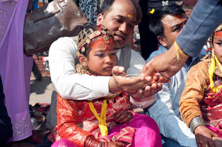 KATHMANDU, NEPAL-FEBRUARY 7: a group of unidentified men, in the plaza hold のeditorial素材