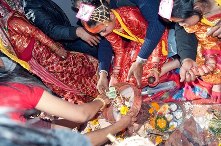 KATHMANDU, NEPAL-FEBRUARY 7: a group of unidentified men, in the plaza hold のeditorial素材