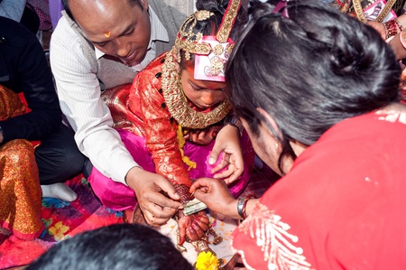KATHMANDU, NEPAL-FEBRUARY 7: a group of unidentified men, in the plaza hold のeditorial素材