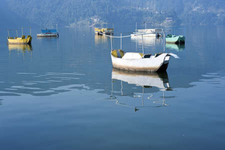 Bright colored wooden boats in Pokharaの写真素材