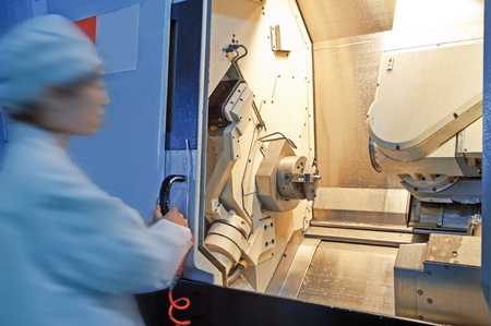 Workers in the operation of CNC machine tools