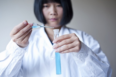 Female workers doing the experimentの写真素材