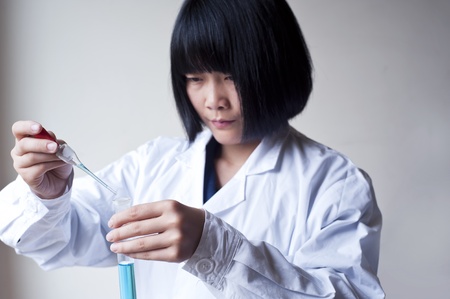 Female workers doing the experimentの写真素材