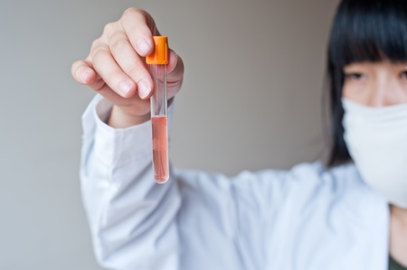 Female workers doing the experimentの写真素材