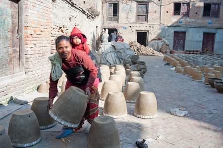 Nepal Bhadgaon  February 4, 2012, the Nepalese women do not know the name, in the production of life with pottery, handmade pottery of Nepal has a long history, a lot of people engaged in this work, Bhadgaon, 2012のeditorial素材