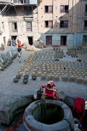 Nepal Bhadgaon  February 4, 2012, the Nepalese women do not know the name, in the production of life with pottery, handmade pottery of Nepal has a long history, a lot of people engaged in this work, Bhadgaon, 2012のeditorial素材