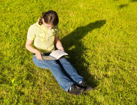 Girl reading a bookの写真素材