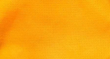 Close up shot of orange textured football jerseyの写真素材