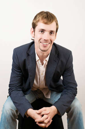 The photo shows a young man in a suit