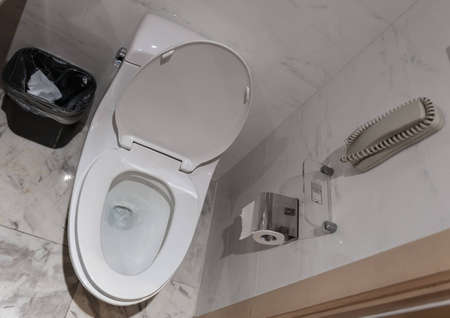 White toilet bowl in the toilet in the hotelの写真素材