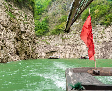 Tourists traveling by canoe on the Yangtze River in Chinaの写真素材