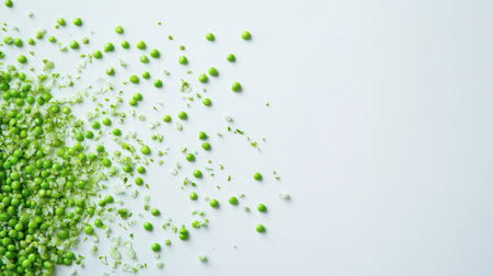 Bright green peas scattered across a smooth light background create a fresh and vibrant feel. Ideal for culinary and healthy living themes.の素材