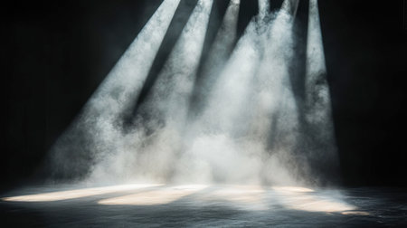 This captivating image captures light rays piercing through fog, creating an ethereal and dramatic atmosphere. Ideal for artistic and theater-themed projects.の素材