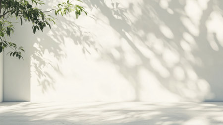 A minimalist setting featuring soft shadows cast by green foliage on a white wall. Ideal for backgrounds, design, and showcasing tranquility in nature.の素材