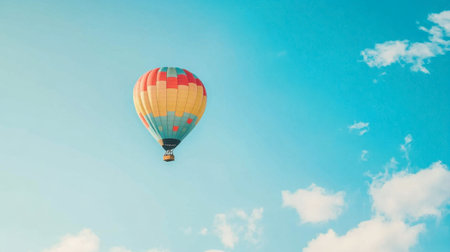 A clear blue sky with a colorful hot air balloon floating peacefully, capturing the essence of adventure.の素材