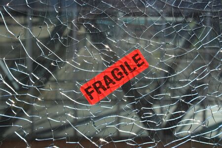 Sticker on a broken window.の写真素材