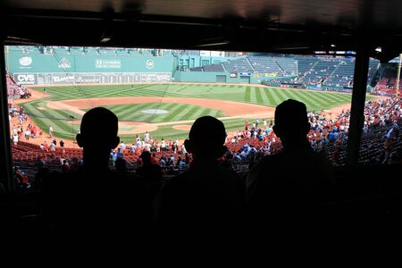 Boston, Massachusetts, USA - August 7th, 2009 - Father and sons watching a game at Fenway Park.のeditorial素材