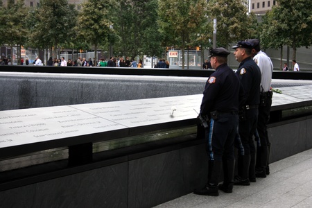 New York City, USA - September 17, 2011 - Police officers at the National 9/11 Memorial at Ground Zero.のeditorial素材